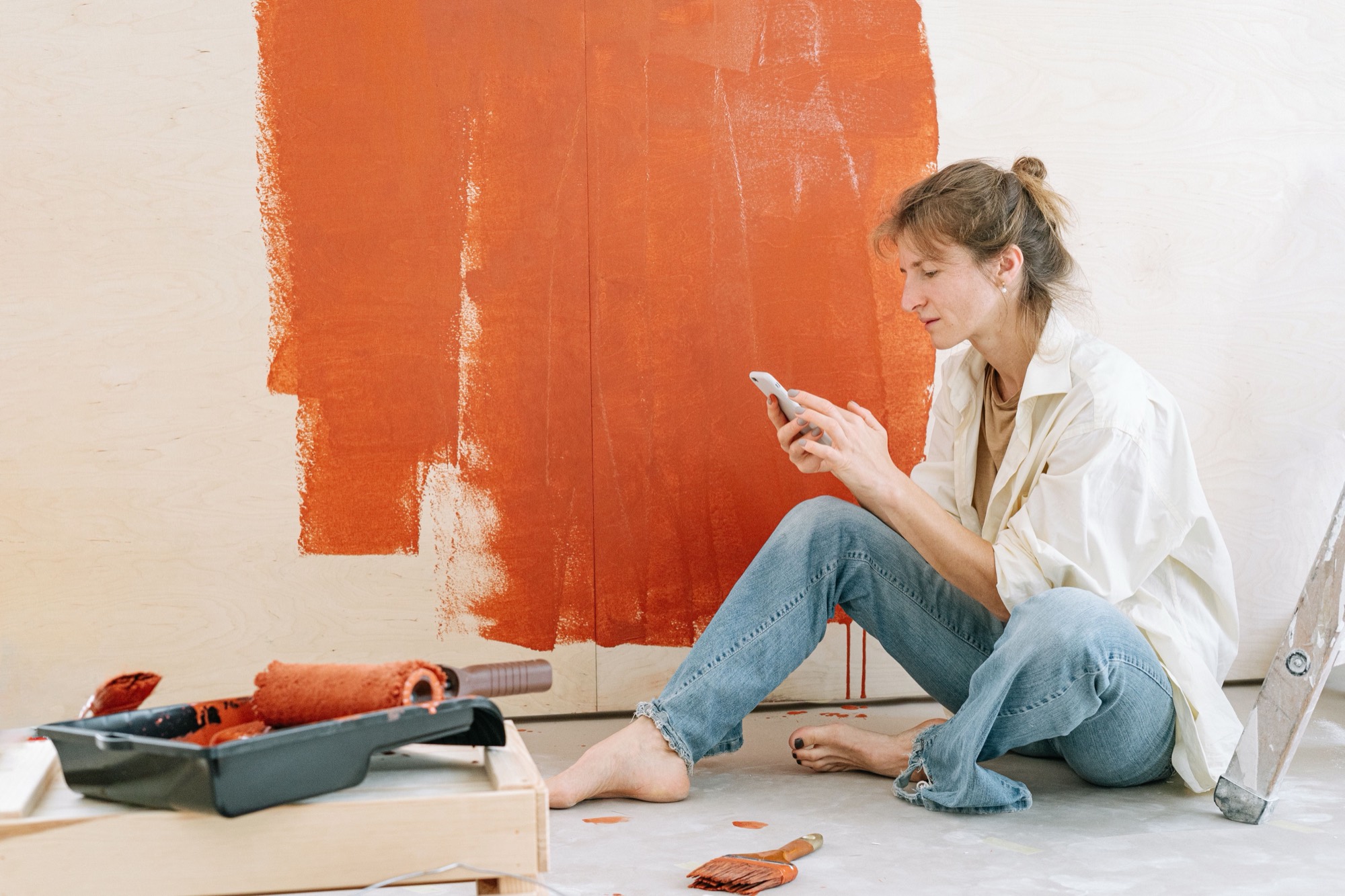 Residential contractor reviewing a project on a phone